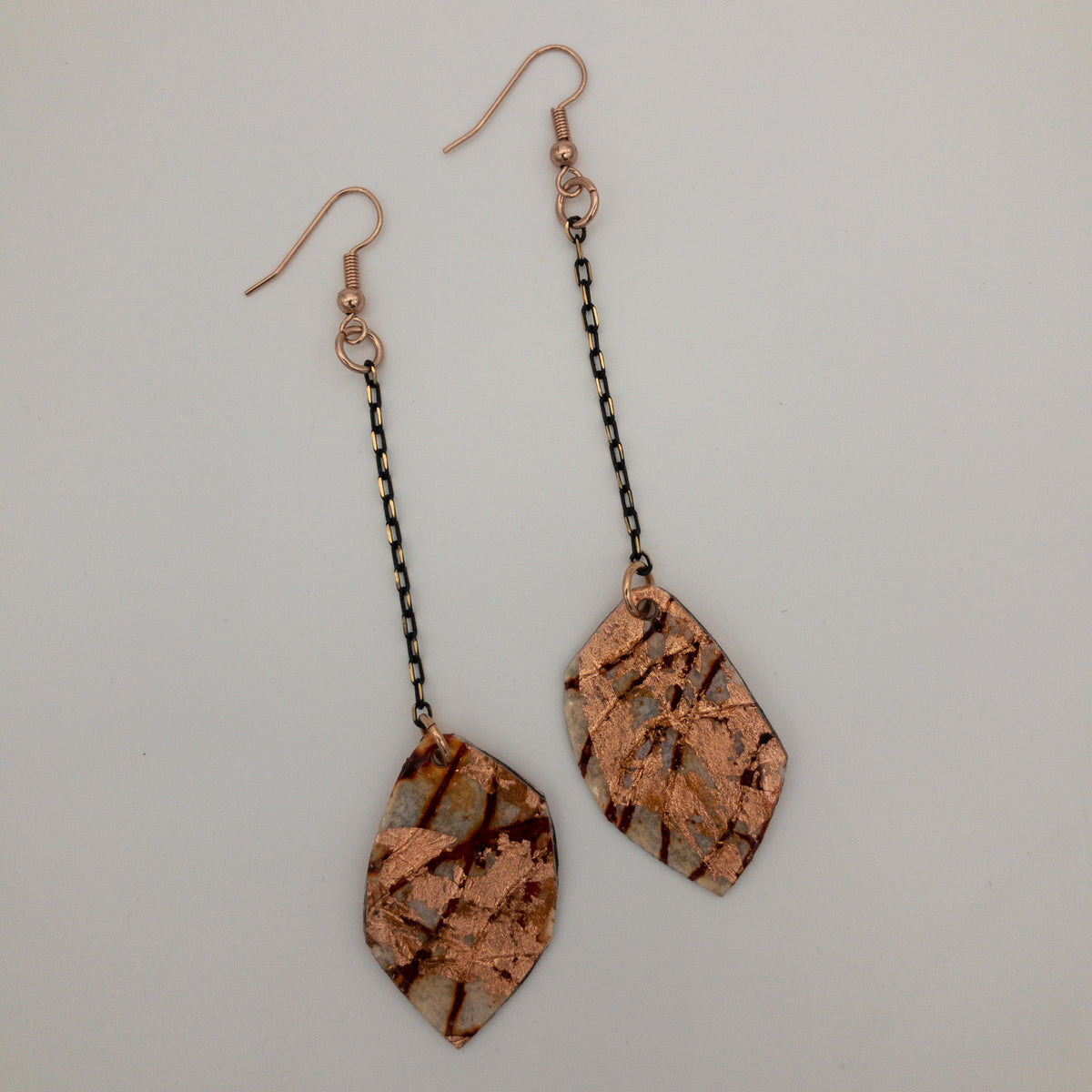 Gile geo batik textile earrings in rust and rose gold
