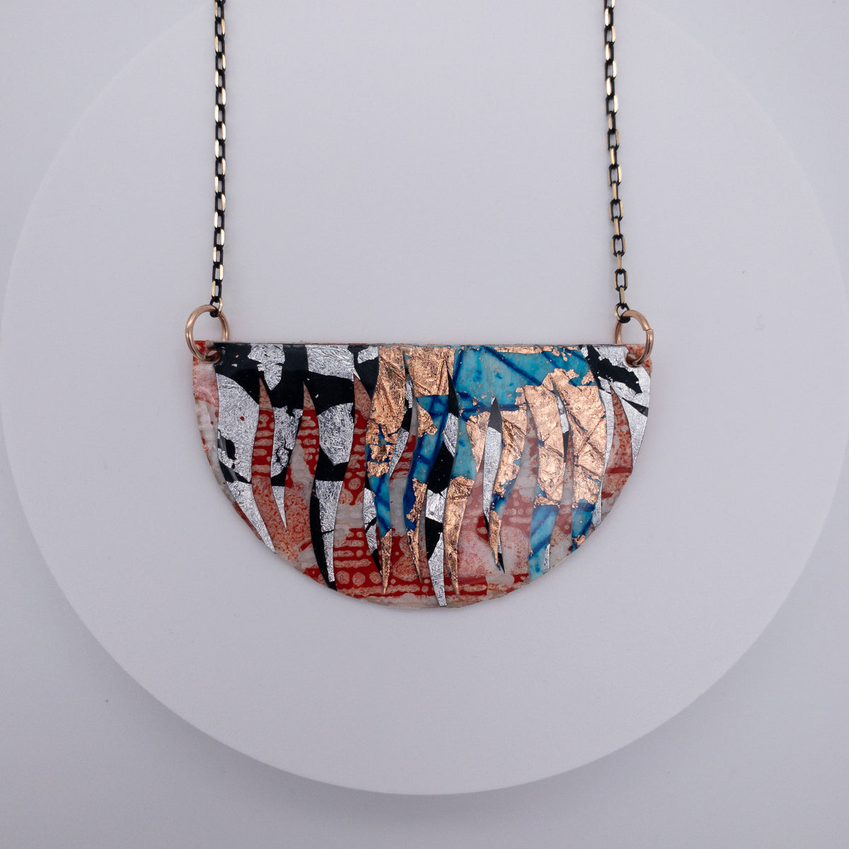 Bláth batik textile necklace in orange/copper/silver/blue/black